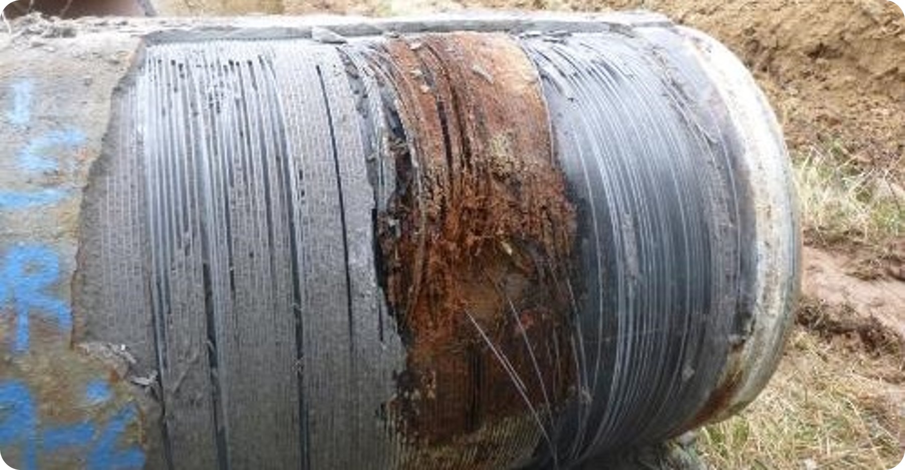 This photo is an example of a prestressed concrete cylinder pipe with wire damage. Photo credit: Denver Water.