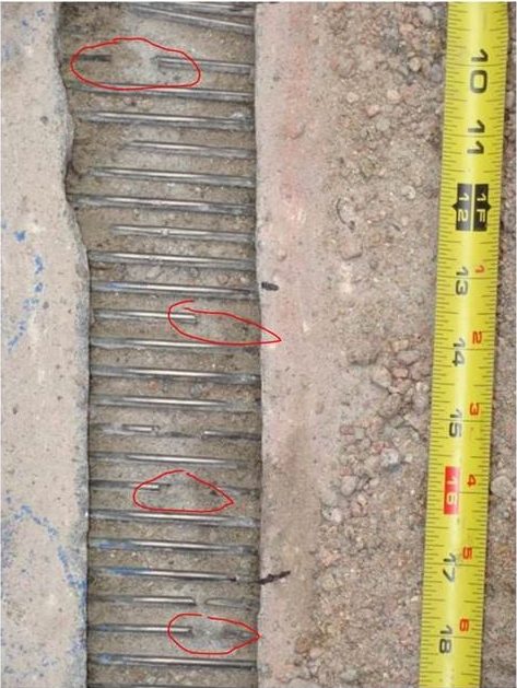 This photo shows the wires around a section of the prestressed concrete cylinder pipe in north Denver. The red circles highlight places where the wire broke This section has been replaced. Photo credit: Denver Water.