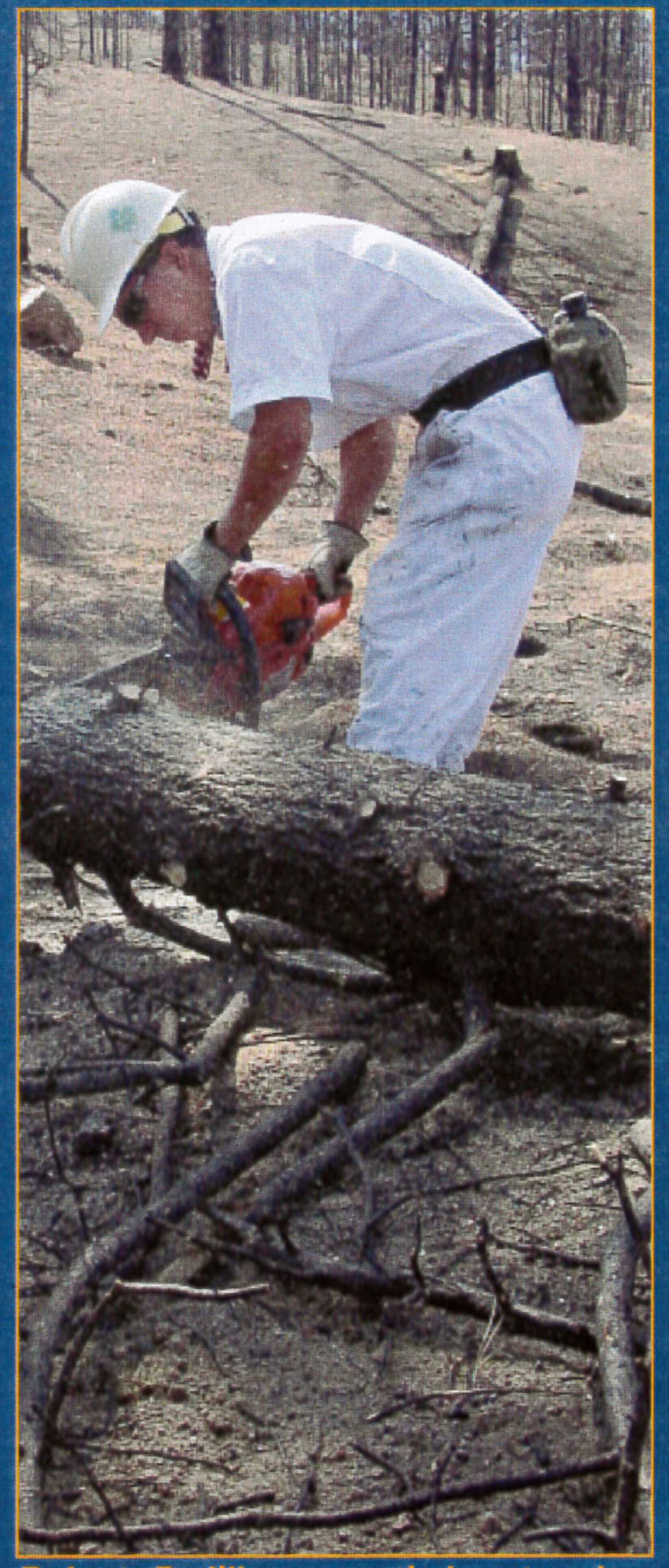 Bobby Padilla saws timber to build a sediment trap.