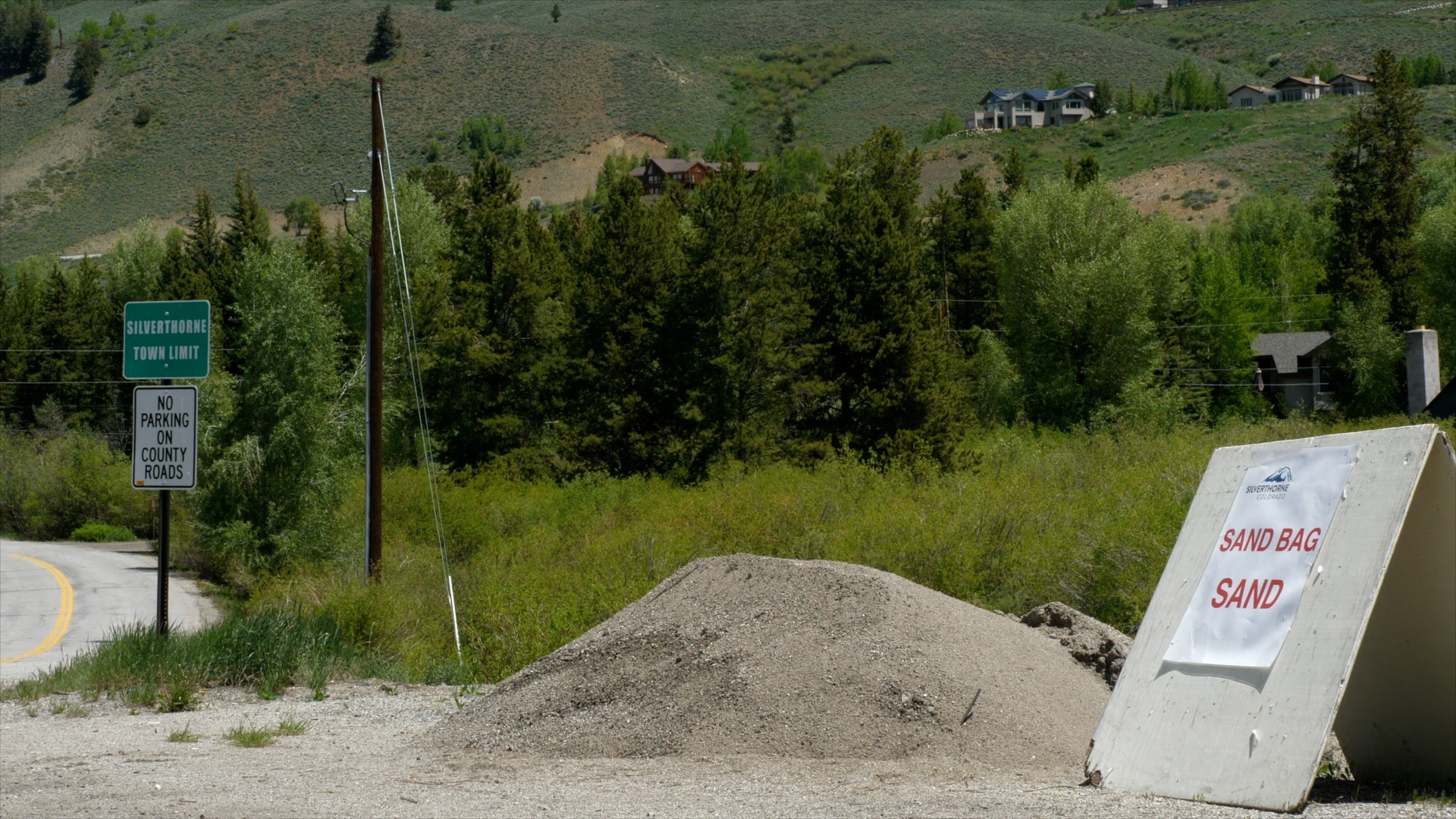 This picture shows a pile of sand that is used to fill sandbags to protect against flooding.