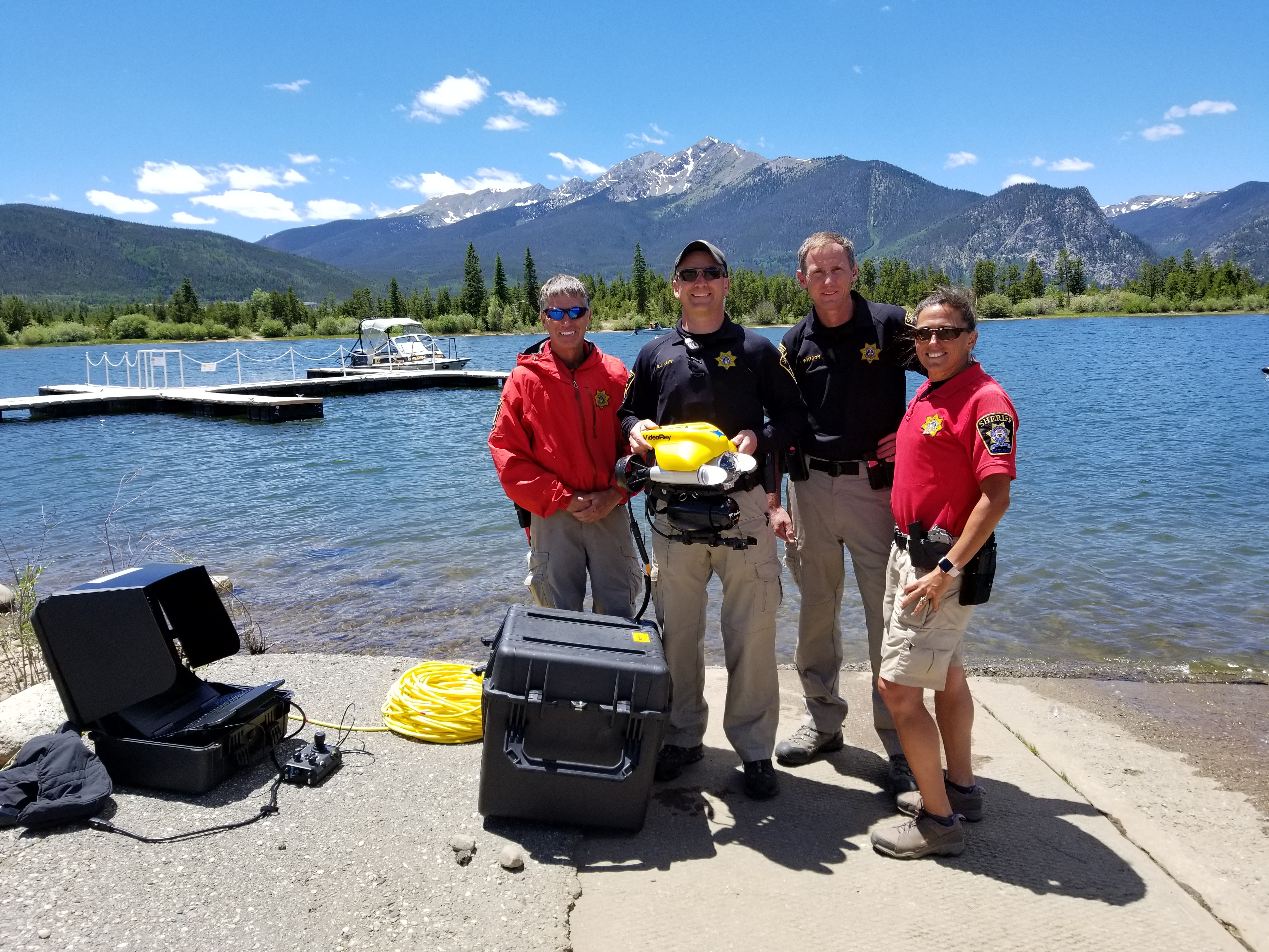 From left, Summit County Sheriff’s Office Ranger Kevin Kelble, Technician SJ Hamit, Sgt. Mark Watson, Ranger Erin Sirek after a training exercise with the office’s new underwater drone device.