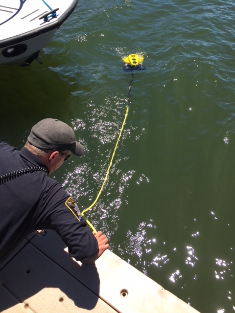 Summit County Sheriff’s Office Technician SJ Hamit during a training with the office’s new underwater drone device.
