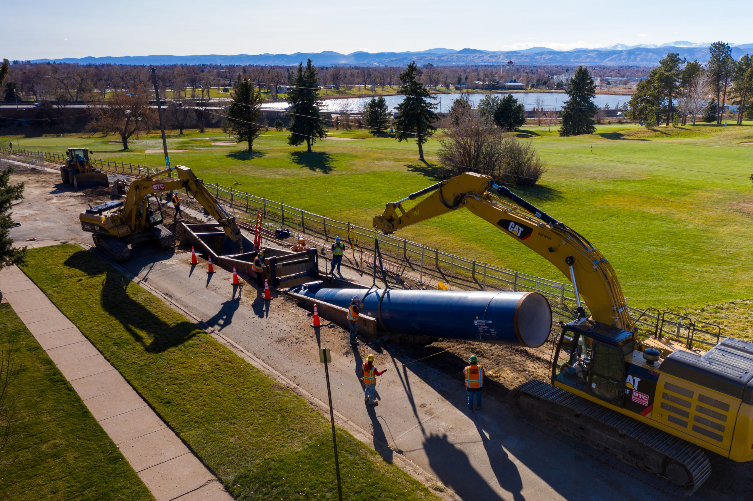 Construction crews install a 50-foot section of steel pipe next to Willis Case Golf Course in northwest Denver in October 2020. Photo credit: Denver Water.