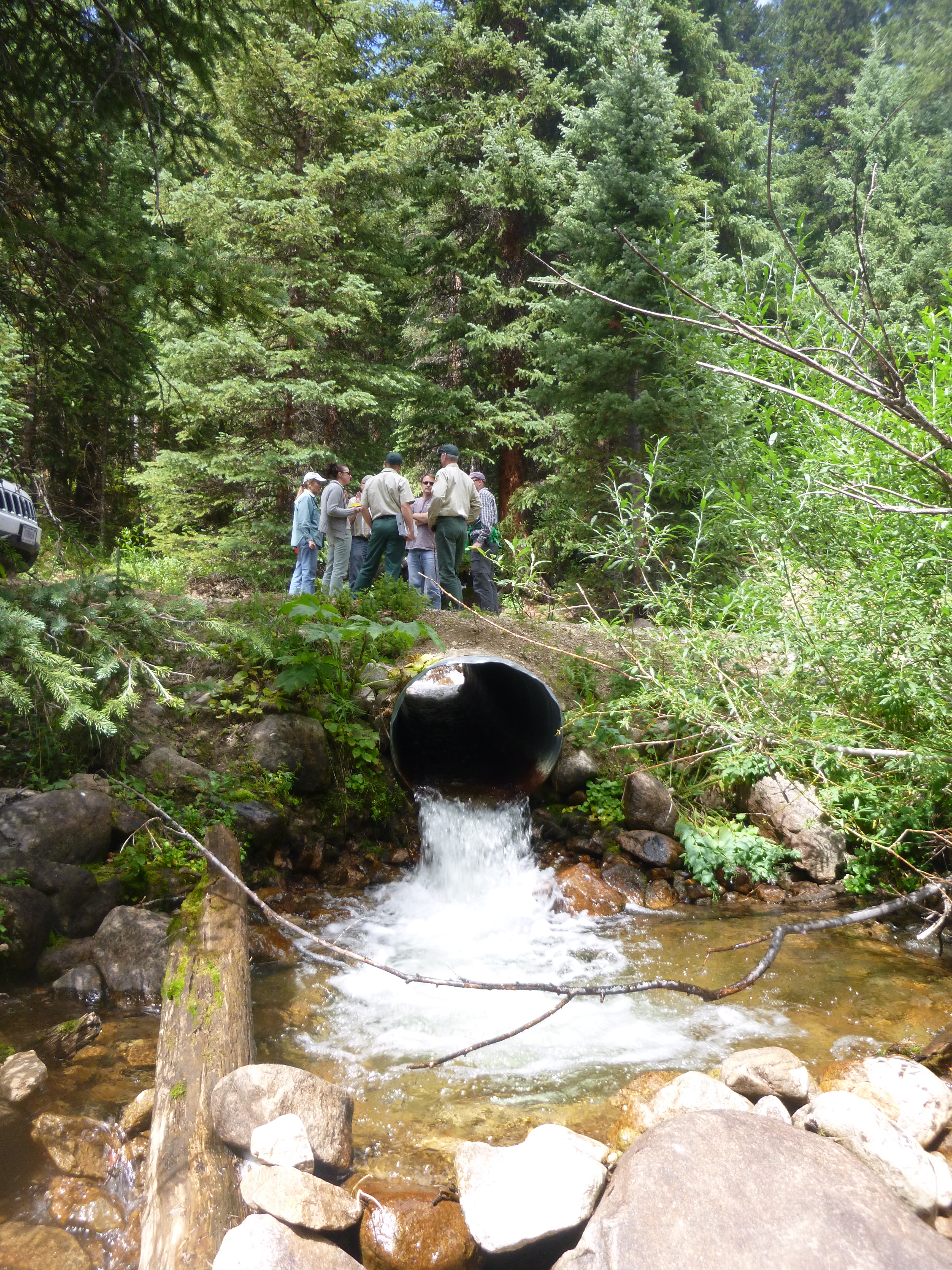 Crews with Denver Water and the U.S. Forest Service meet prior to removal of a traditional culvert that will be replaced with an "aquatic organism passage." The new passage will make movement easier and safer for small species, including boreal toads.