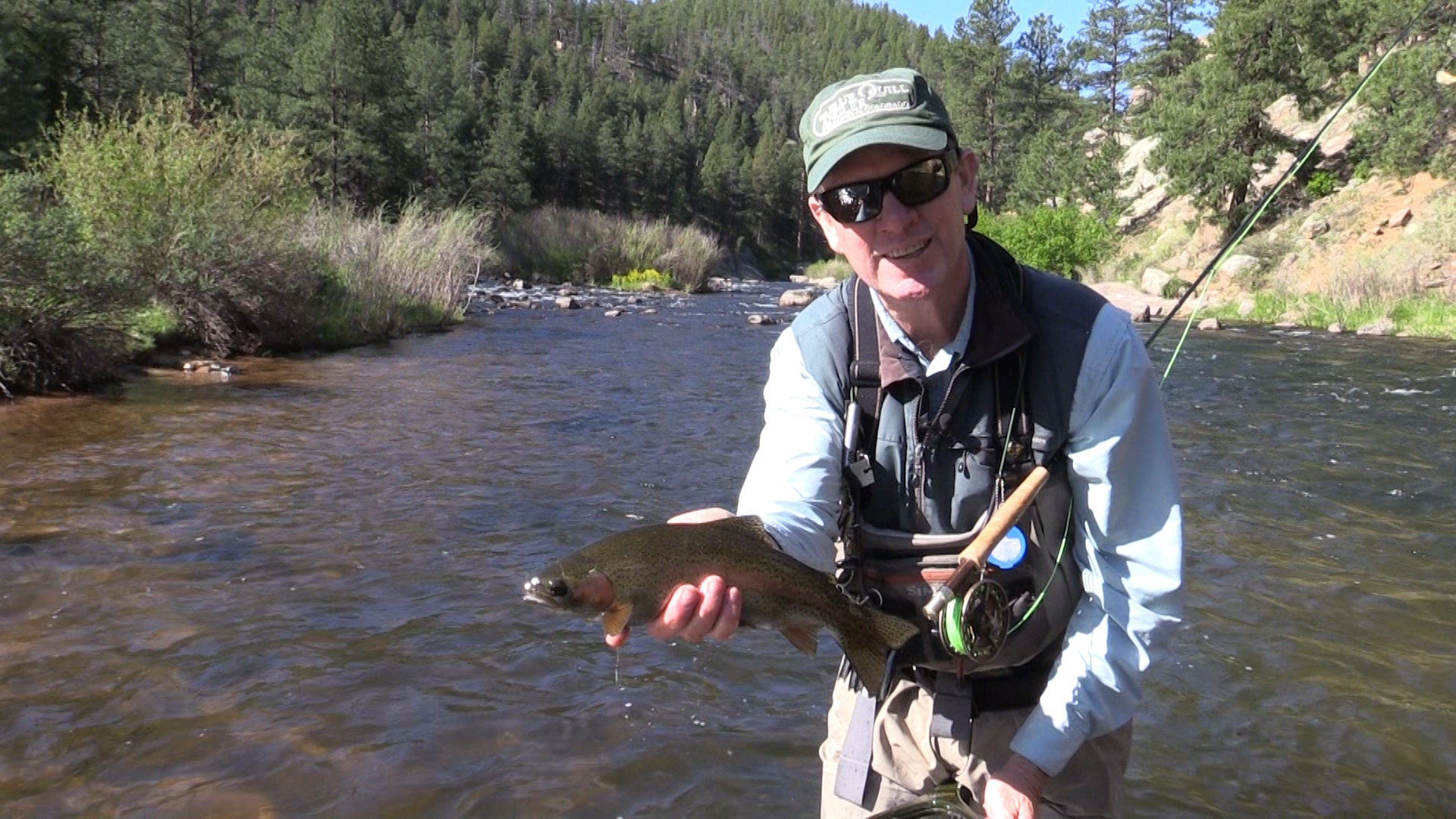 Fly Fishing guide Pat Dorsey shows off a rainbow trout in Cheesman Canyon.
