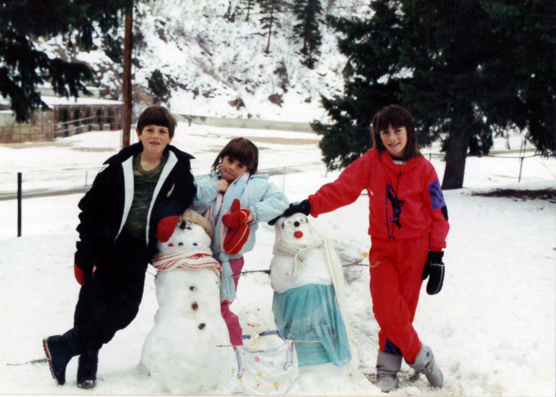 Winter 1989: The author, right, with her brother Jason and sister Katie, in their first winter living in Waterton Canyon. The concrete remnants of the Platte Canyon diversion dam — a favorite fishing spot — are pictured in the background.