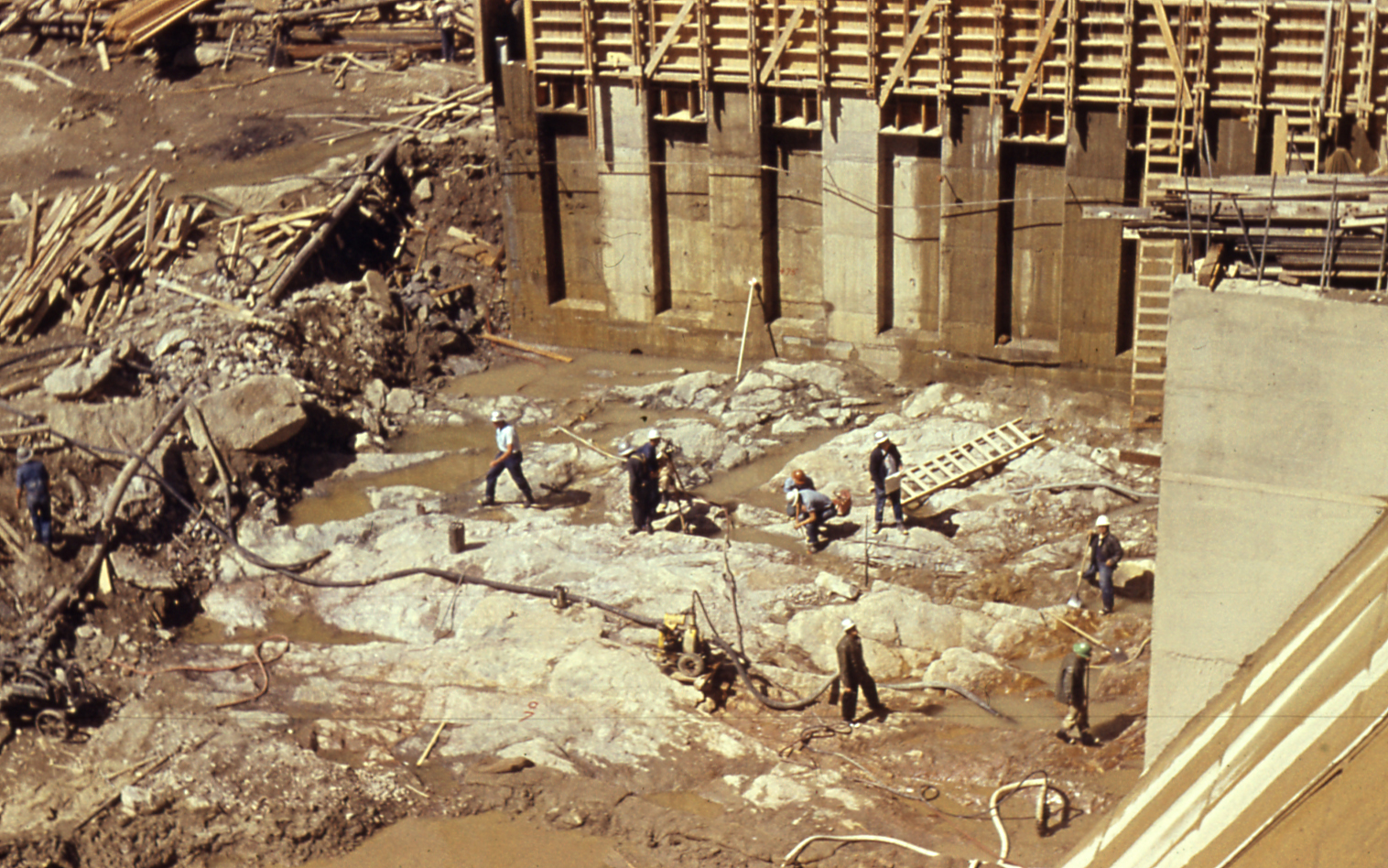This picture shows men working at the base of the valley where Gross Dam was built.