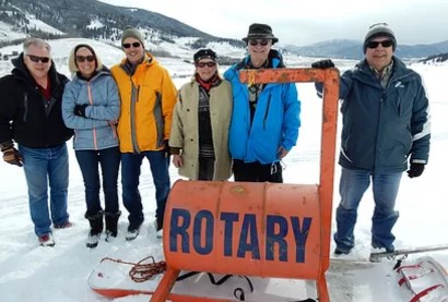Rotary Club of Summit County members stand behind the "ice device." Photo courtesy of the Rotary Club of Summit County