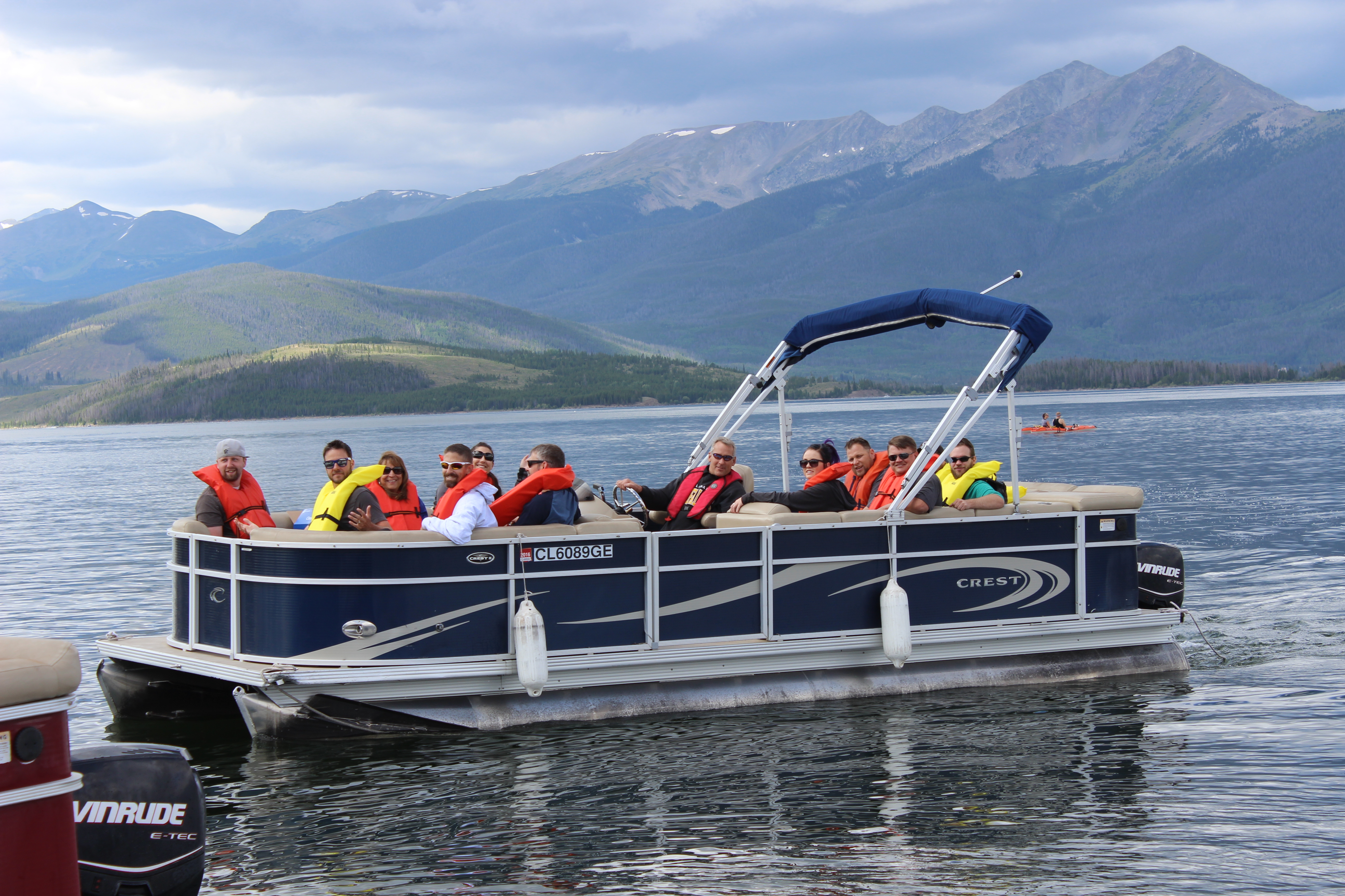 Employees on a boat at Dillon Reservoir to see how operations work.