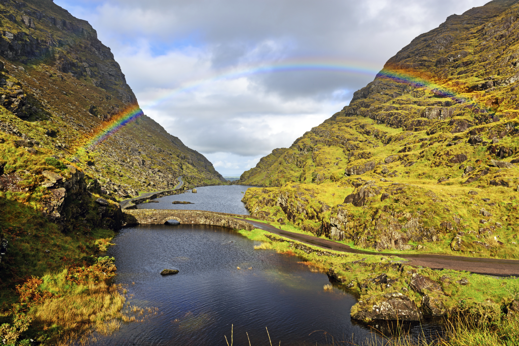 Rainbow over bridge and lake in the Gap of Dunloe, County Kerry, Ireland. Picturesque mountainous landscape. (Courtesy ©iStock.com/stevegeer)