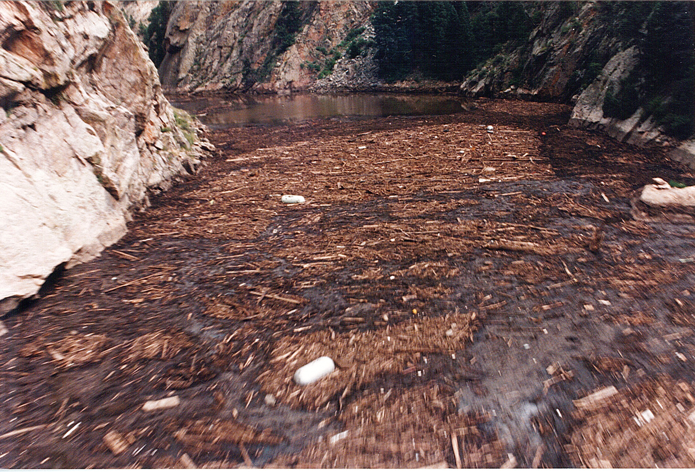 Debris filled Strontia Springs Reservoir after the Buffalo Creek fire and flood of 1996. Photo credit: Denver Water.