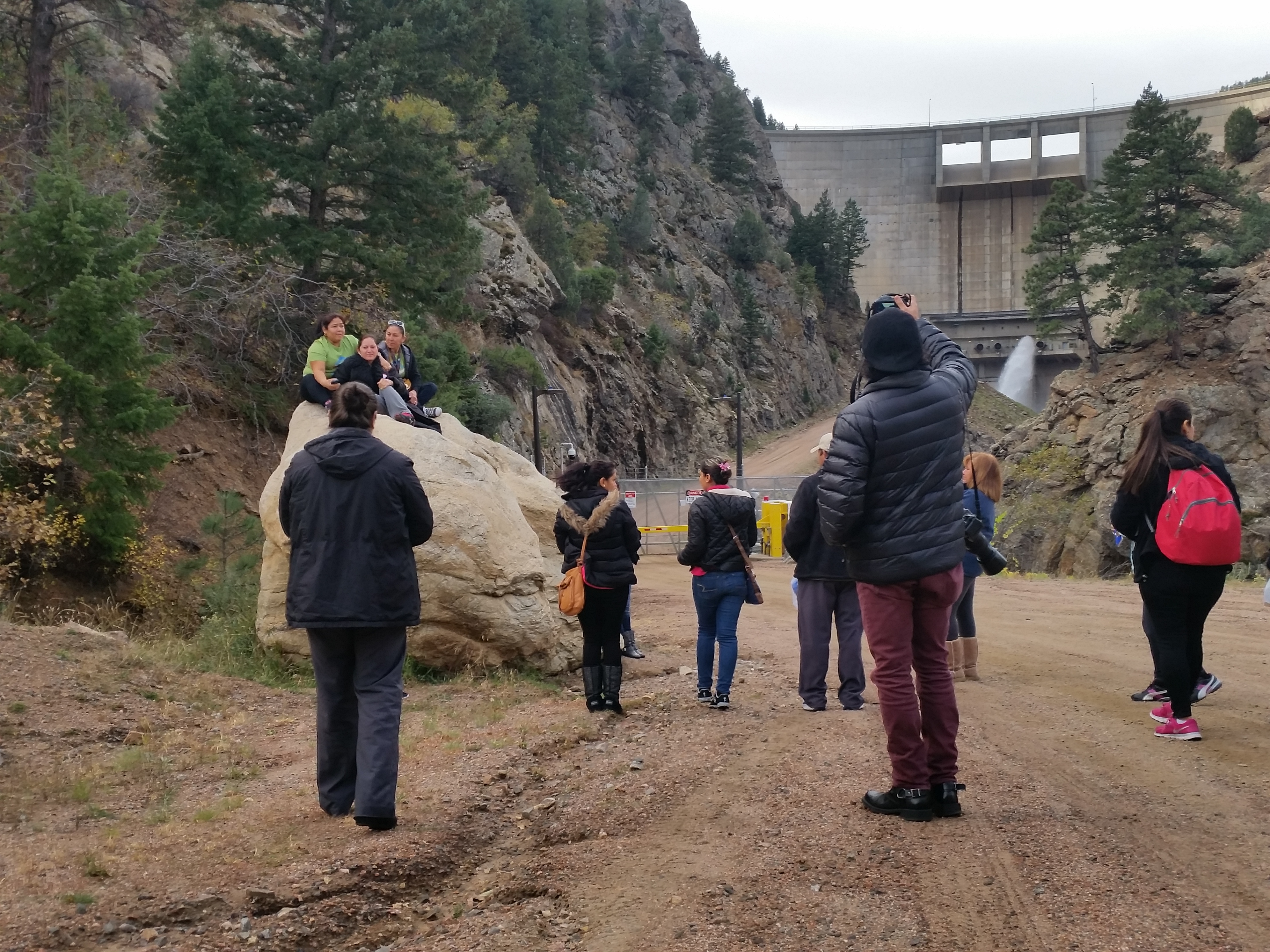 Community members from Westwood Unidos explore at the base of Strontia Springs dam,